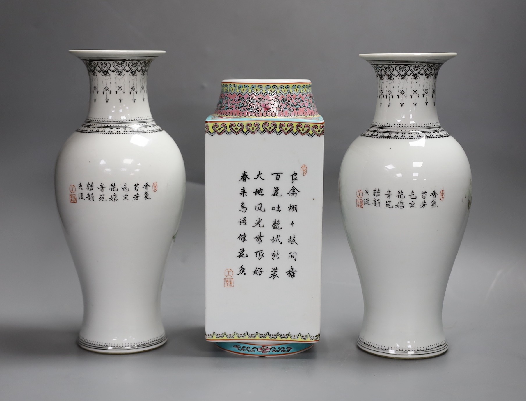 A pair of early Chinese famille rose vases and another similar, Republic period, tallest 26cm